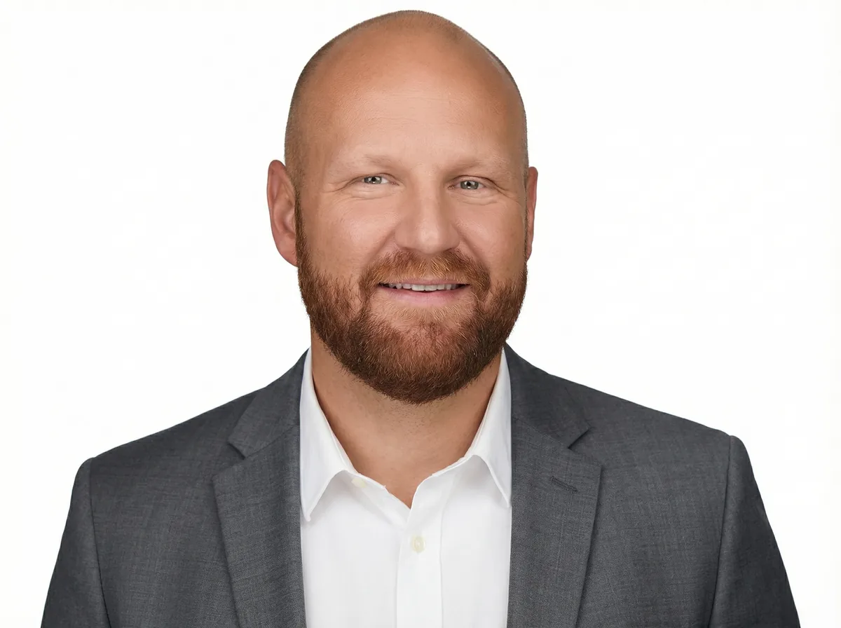 Professional headshot of man in business attire. Design, Works, Engineering expertise.