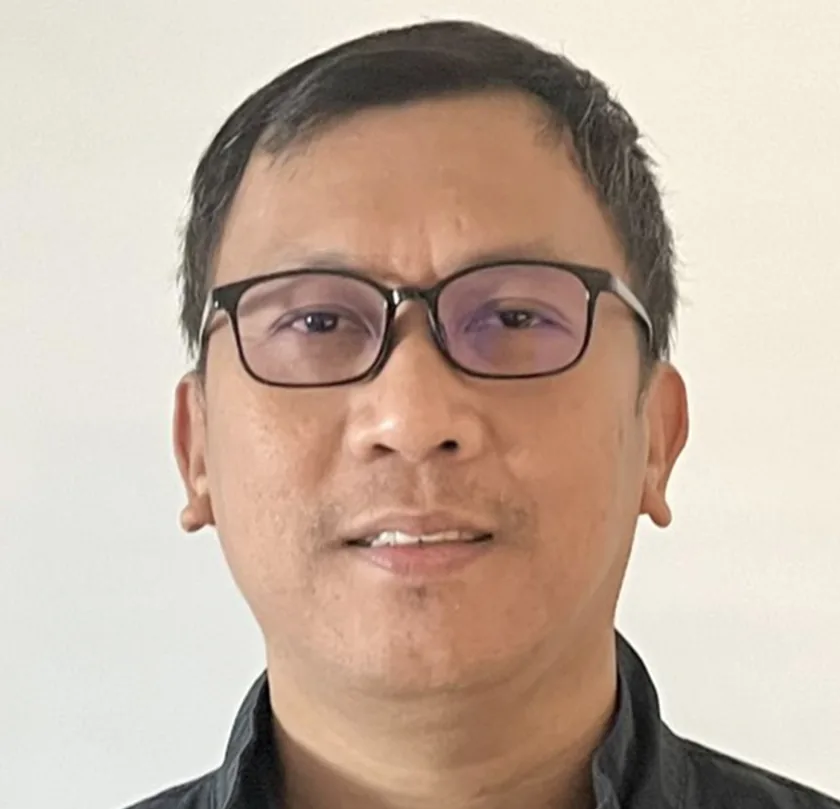 Professional portrait of man with glasses; design, works, engineering expert.