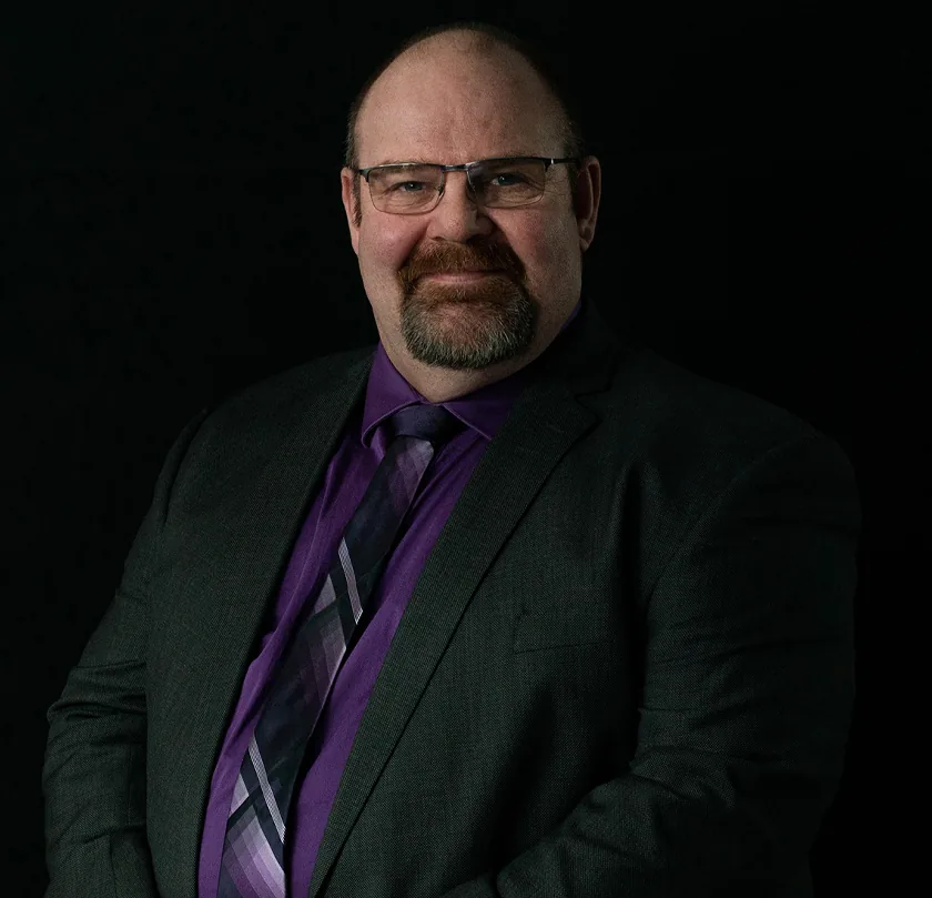 Professional engineer in design works portrait wearing glasses and purple tie