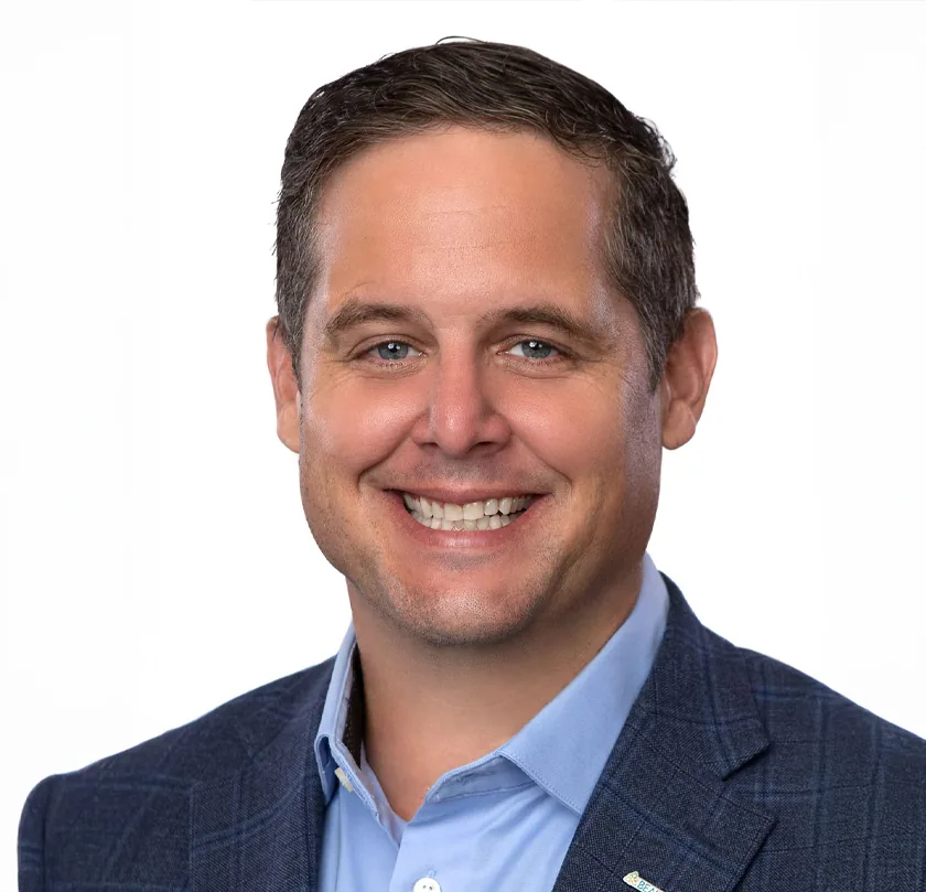 Professional portrait of smiling man showcasing Design, Works, and Engineering expertise