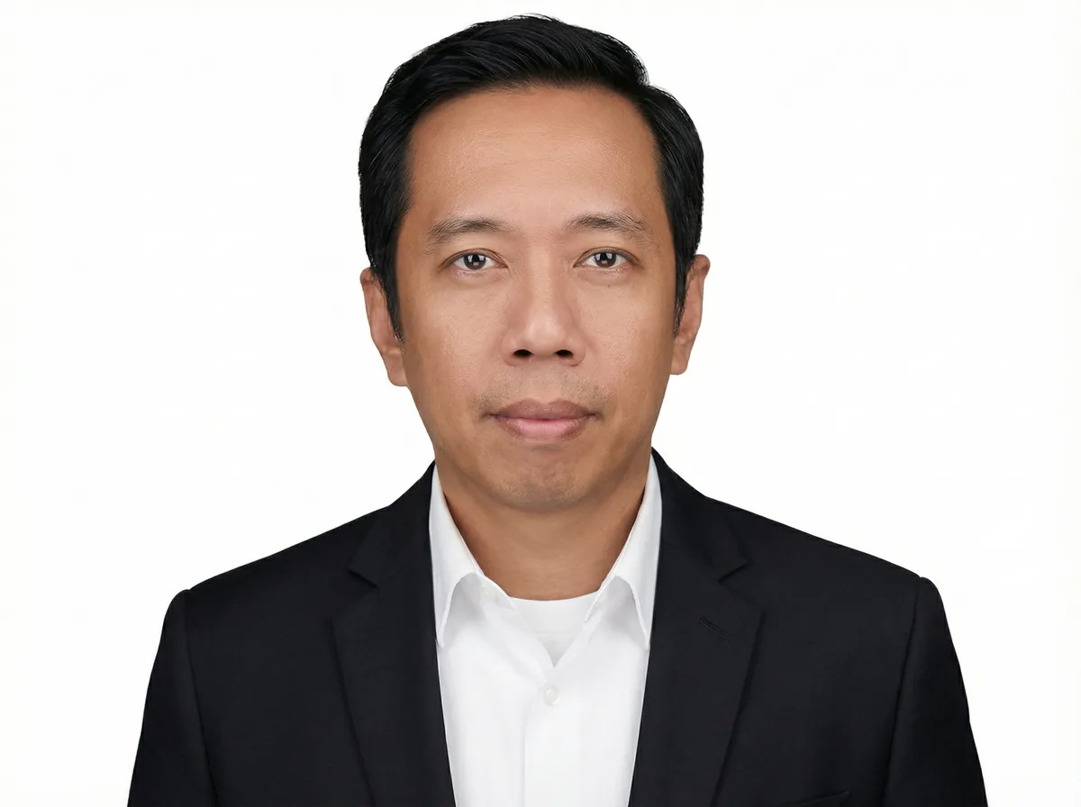 Professional portrait of man in business attire whose design works in engineering transform industries