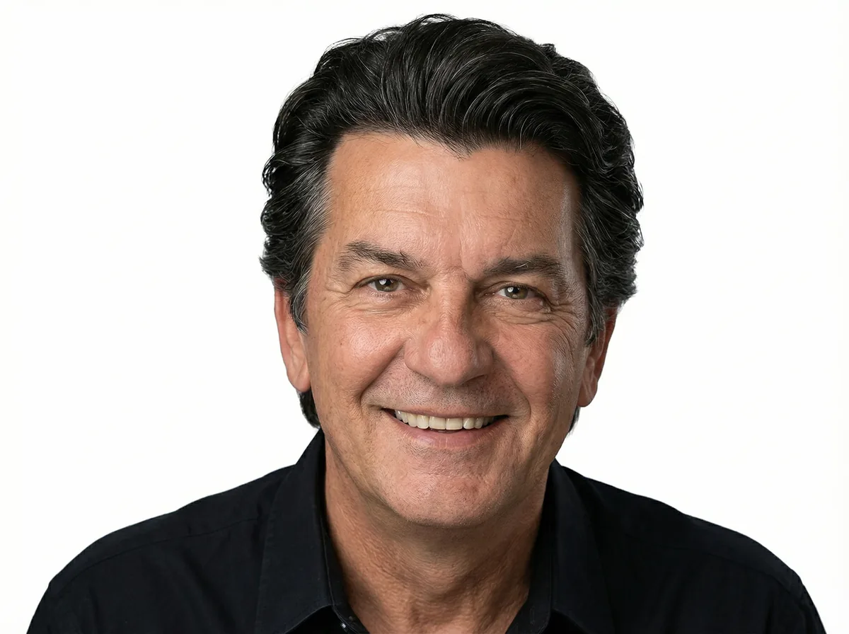 Professional Design and Engineering Works portrait of smiling middle-aged man in black shirt
