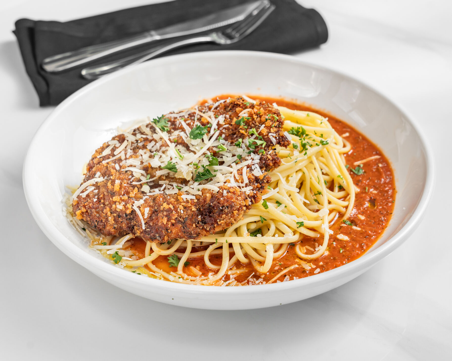 Plate of Romano Crusted Chicken + Pasta