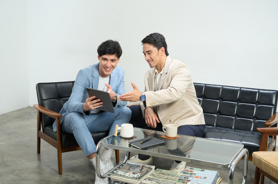 Customer interaction on tablet in a business meeting.