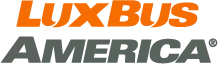 Lux Bus America logo with orange LuxBus text above grey America text on a dark background.