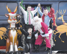 Santa with excited four-year-old Ollie, Transit Systems CEO Clint Feuerherdt and Novita CEO Greg Ward.
