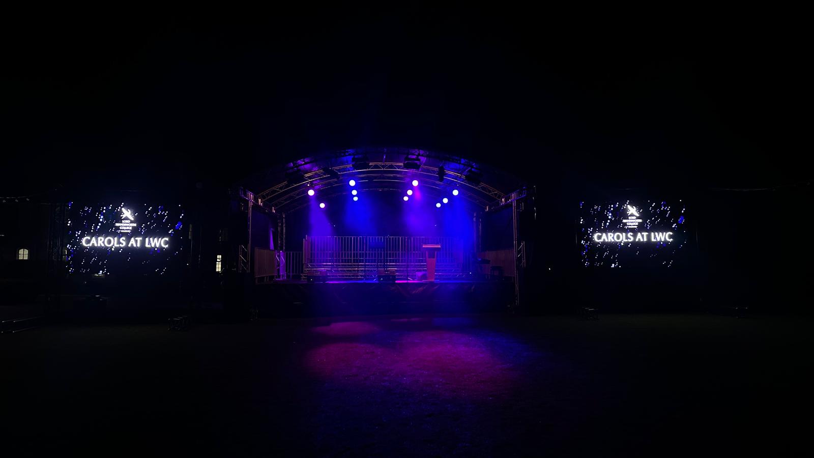 Temporary event stage and screen setup with access planned around the venue