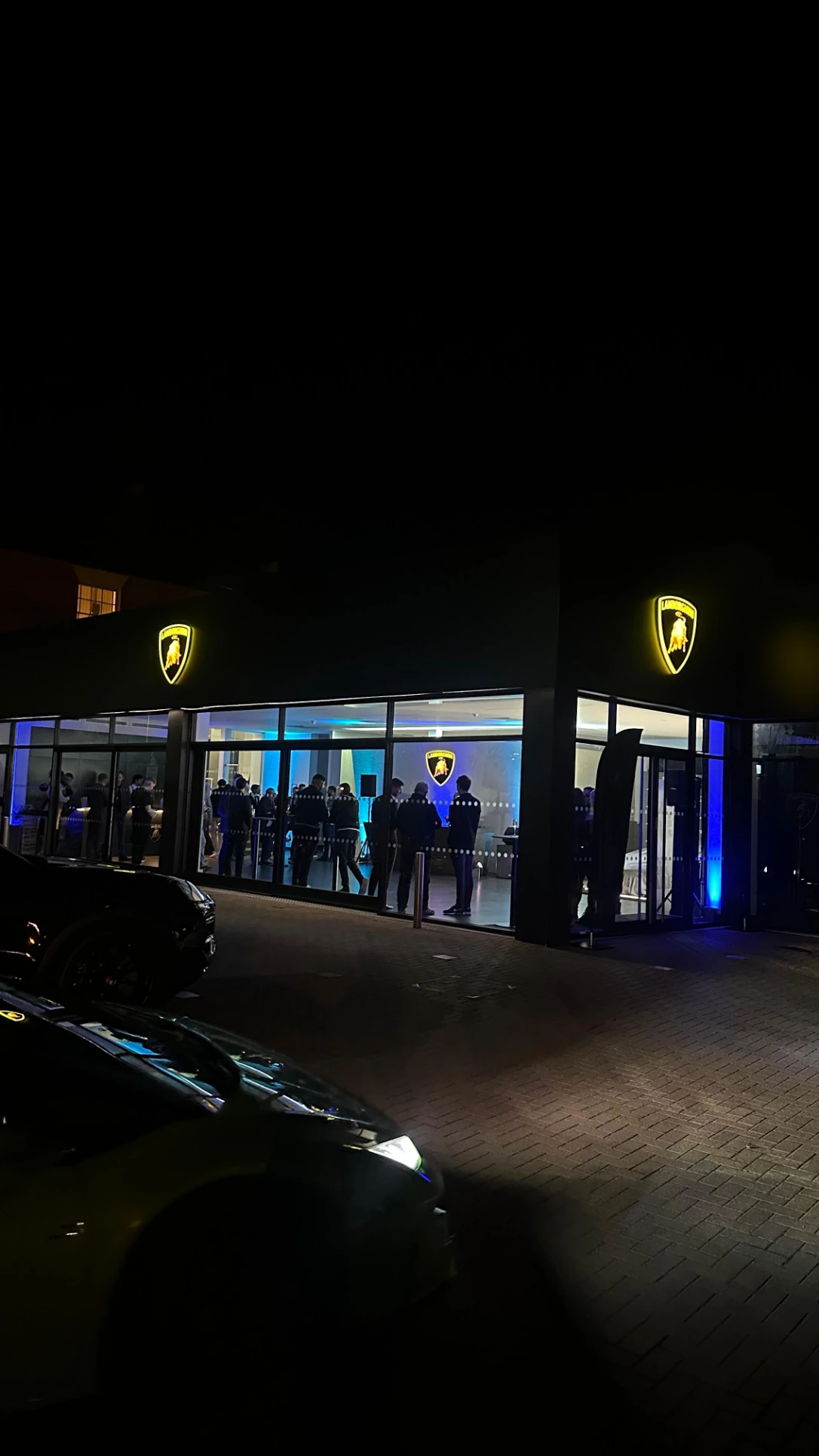 Illuminated automotive showroom prepared for a night-time brand event