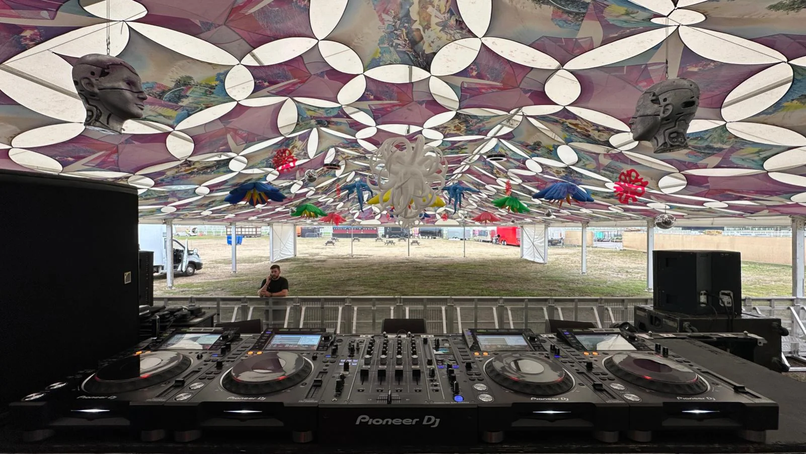 Professional DJ and event production equipment inside a decorated venue