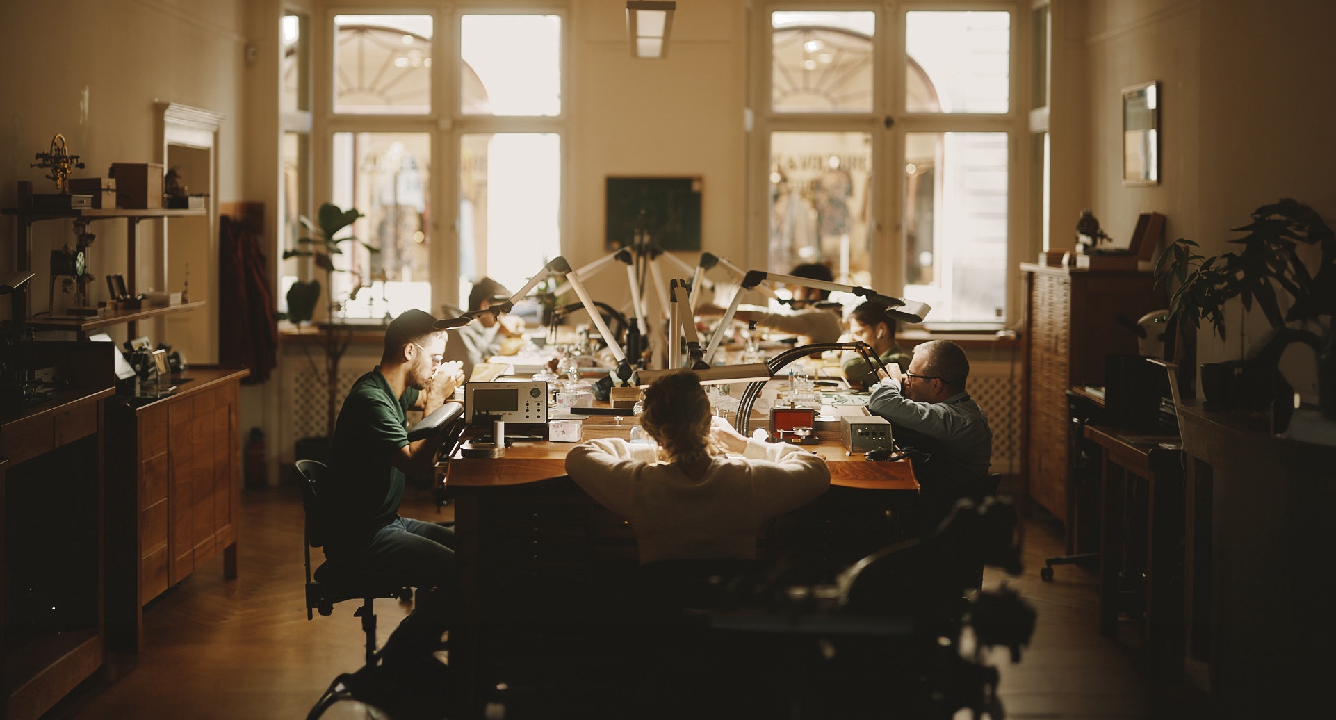 Watchmakers of Rexhep Rexhepi's atelier at their bench in the heart of Geneva's Old town