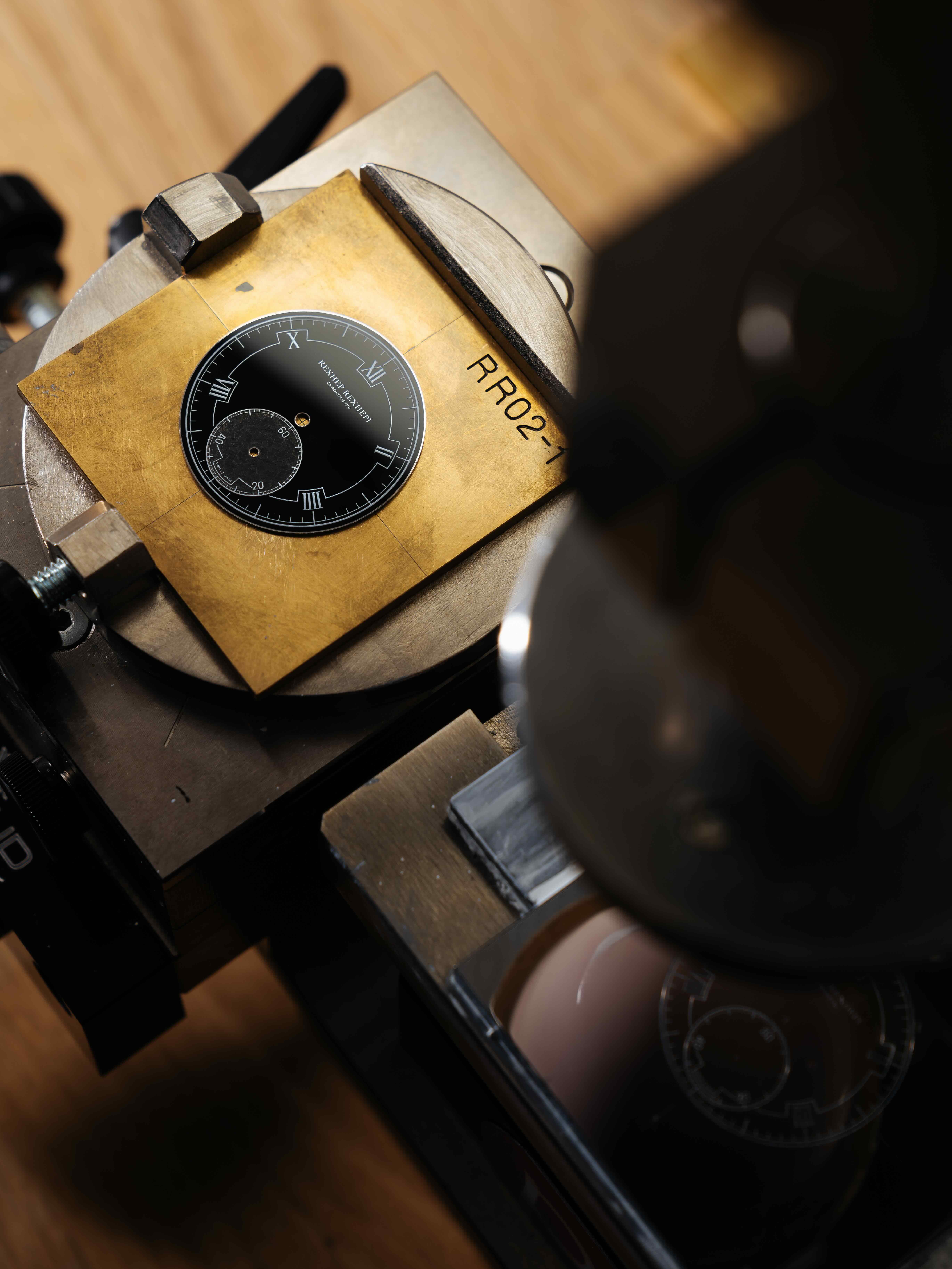 Pad printing process of silver indices on the black enamel dial of the RRCC II
