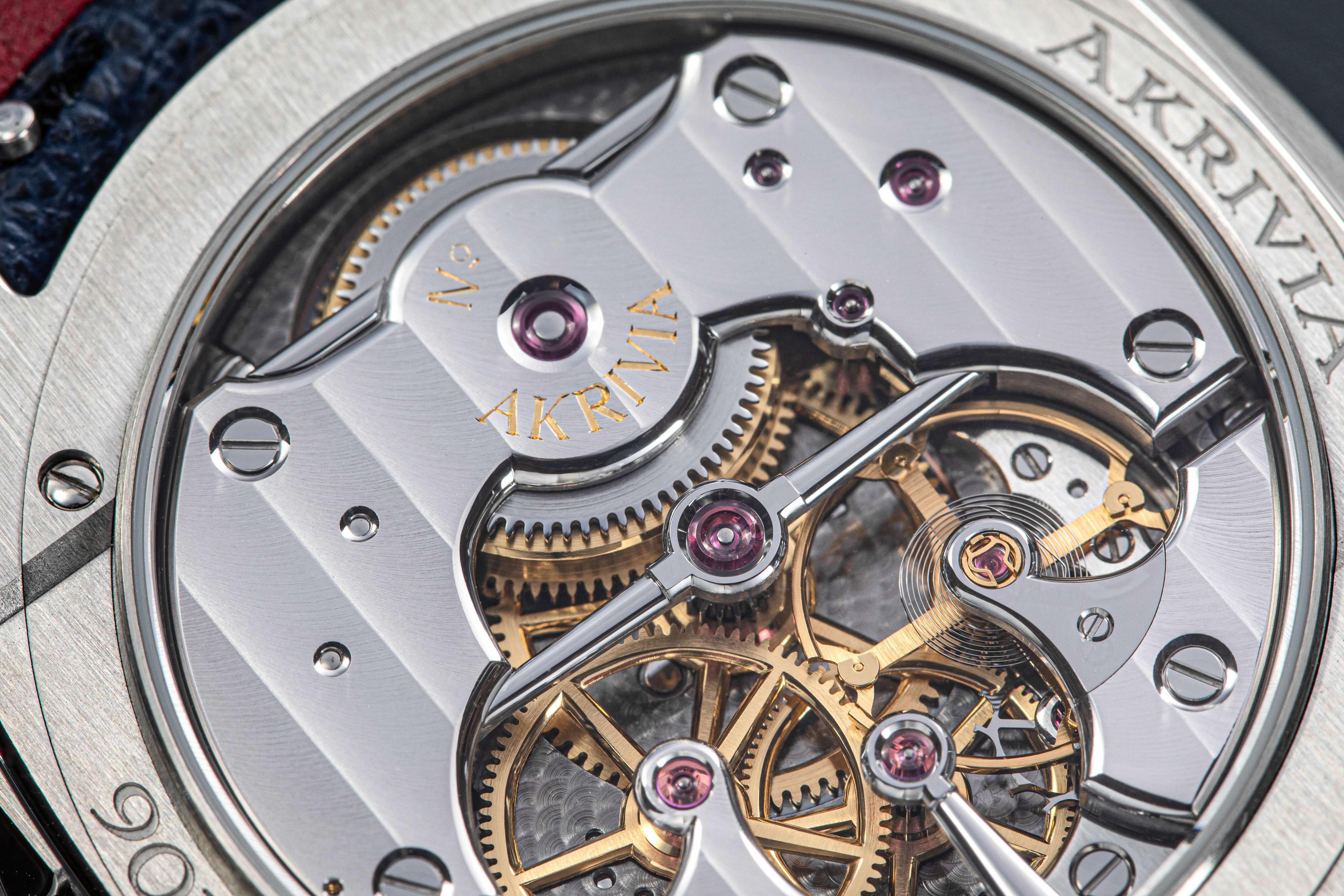 Close-up on the back movement of the AK-06 in stainless steel and zoom on the hand-decoration Akrivia