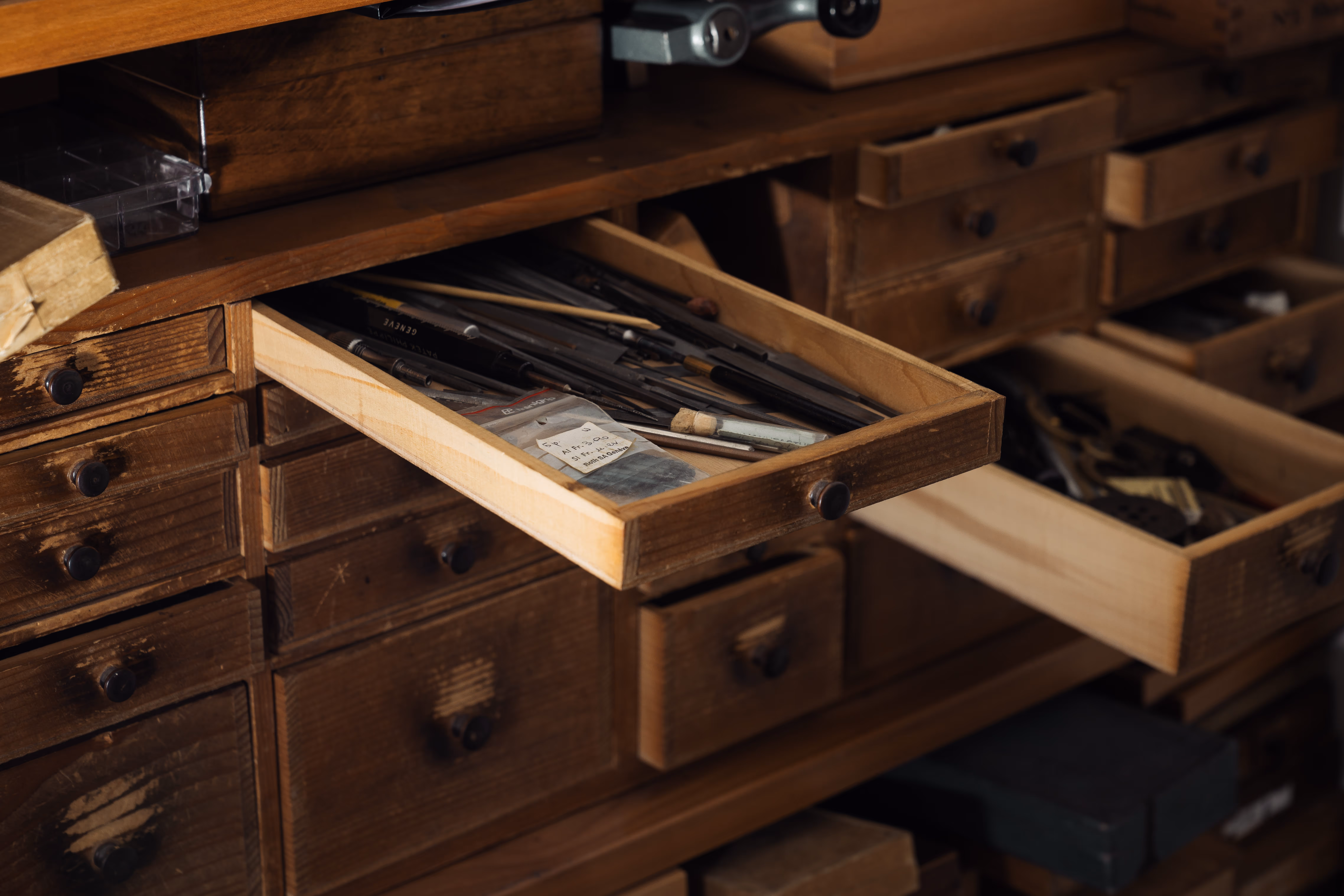 Two drawers with tools opened of the watchmaking layette and storage in the Rexhep Rexhepi atelier in Geneva