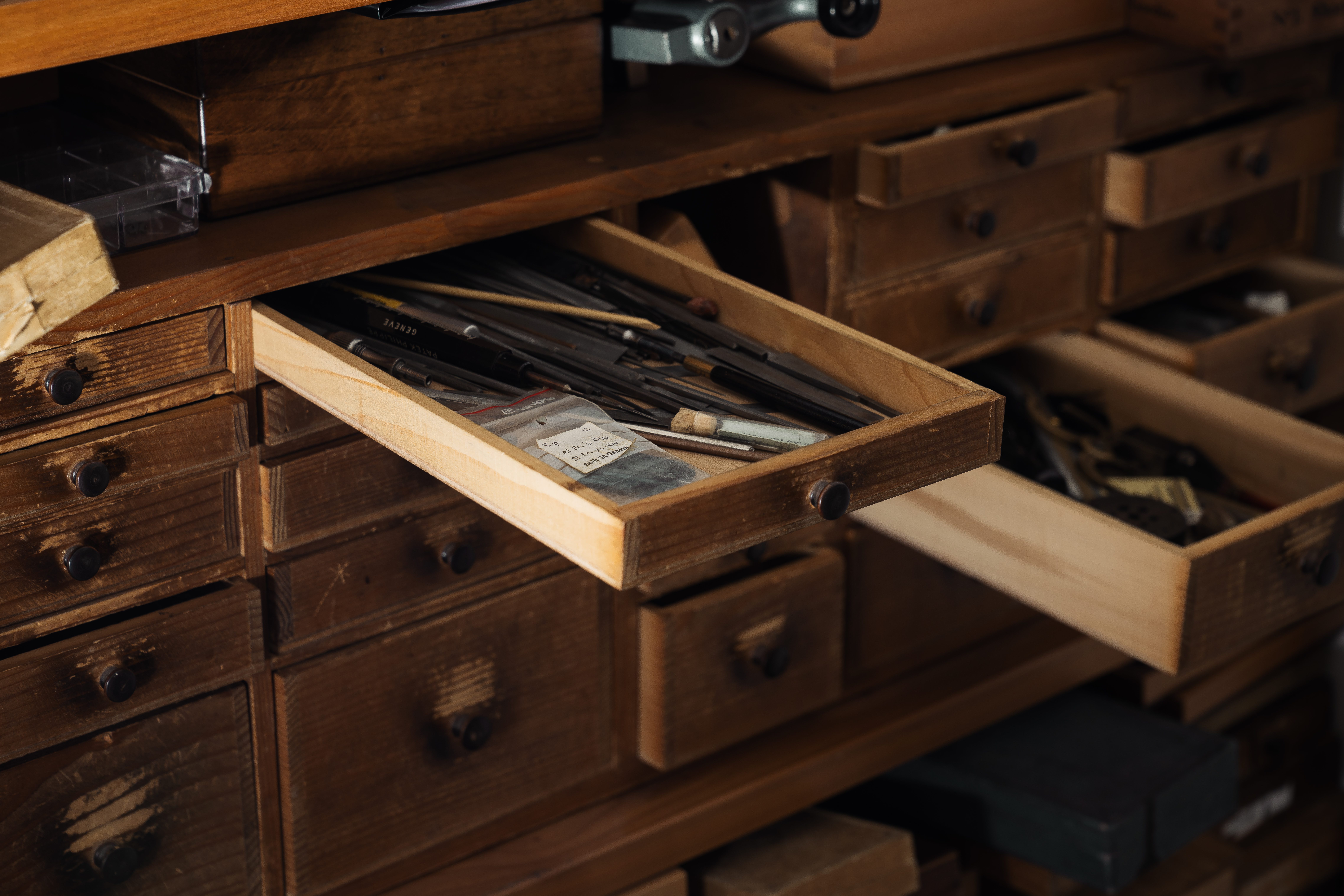 Two drawers with tools opened of the watchmaking layette and storage in the Rexhep Rexhepi atelier in Geneva