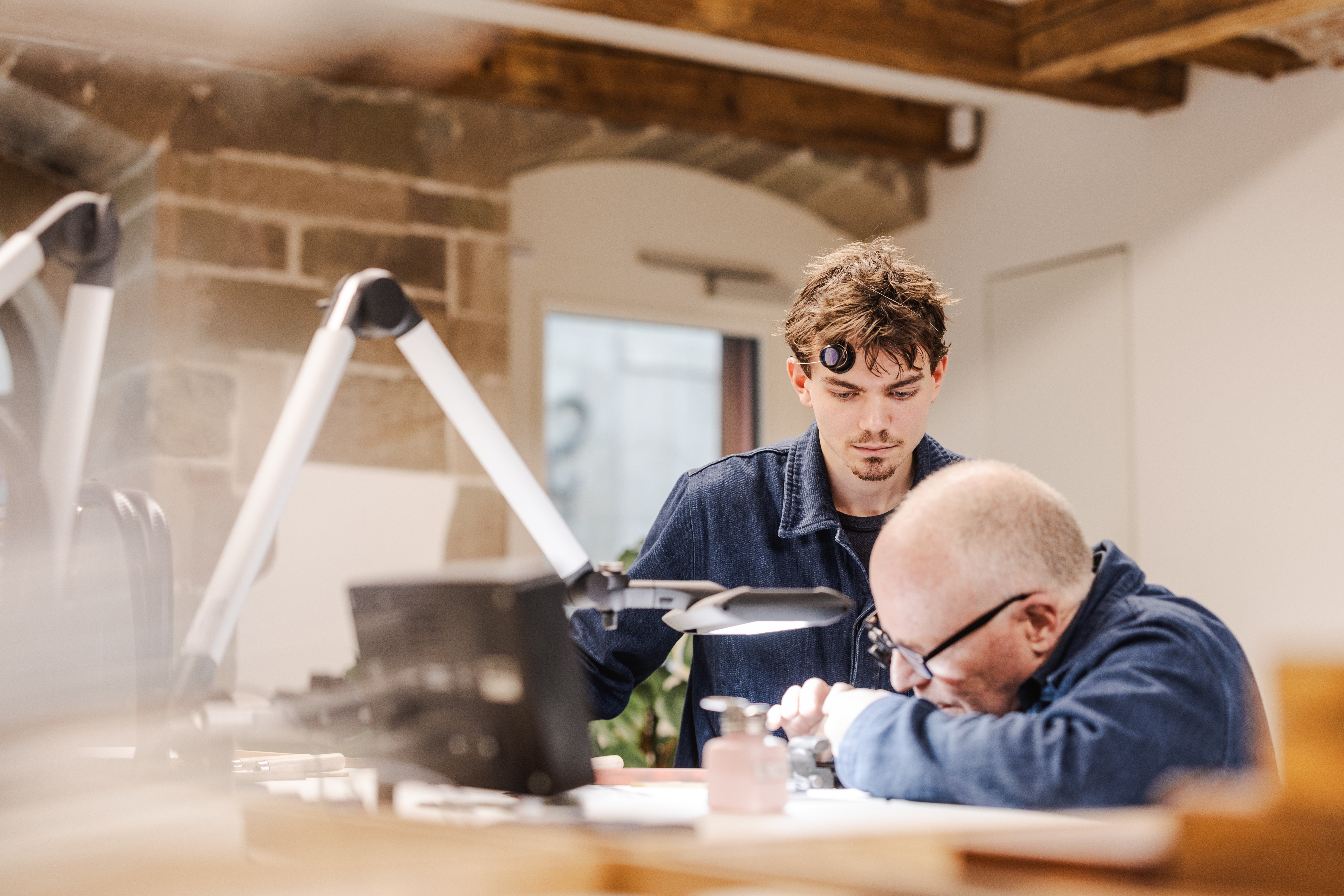 Jean-Marc Figols showing his apprentice the art and craft of watchmaking in Rexhep Rexhepi's new workshop dedicated to teach future artisans 