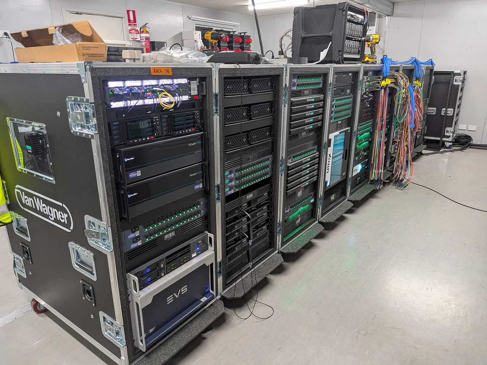 Professional AV fly-pack racks featuring Cisco switches and EVS servers for Van Wagner touring network.