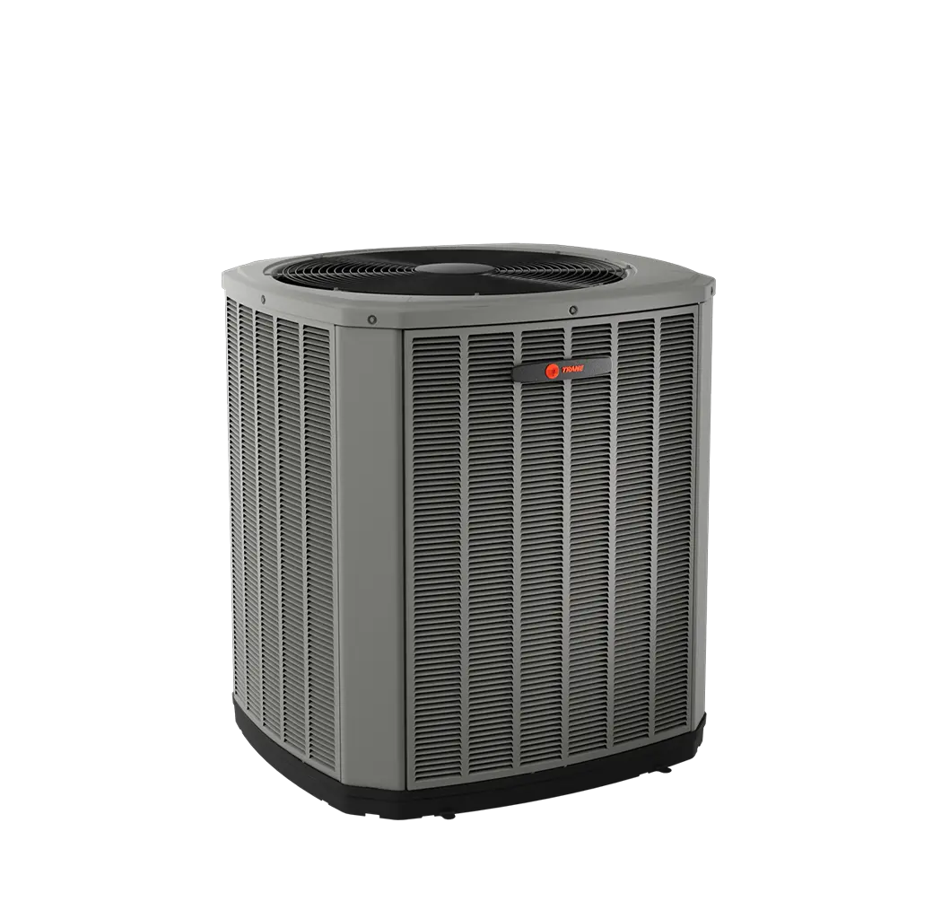 An outdoor HVAC unit, likely an air conditioner or heat pump, manufactured by Trane. The unit is a large, octagonal or square-shaped condenser with a gray cabinet featuring vertical louvers on all sides for airflow. It has a black fan grille on top, with the fan visible underneath, and a small, red Trane logo visible near the top on one of the side panels. It is shown against a plain light gray or white background.