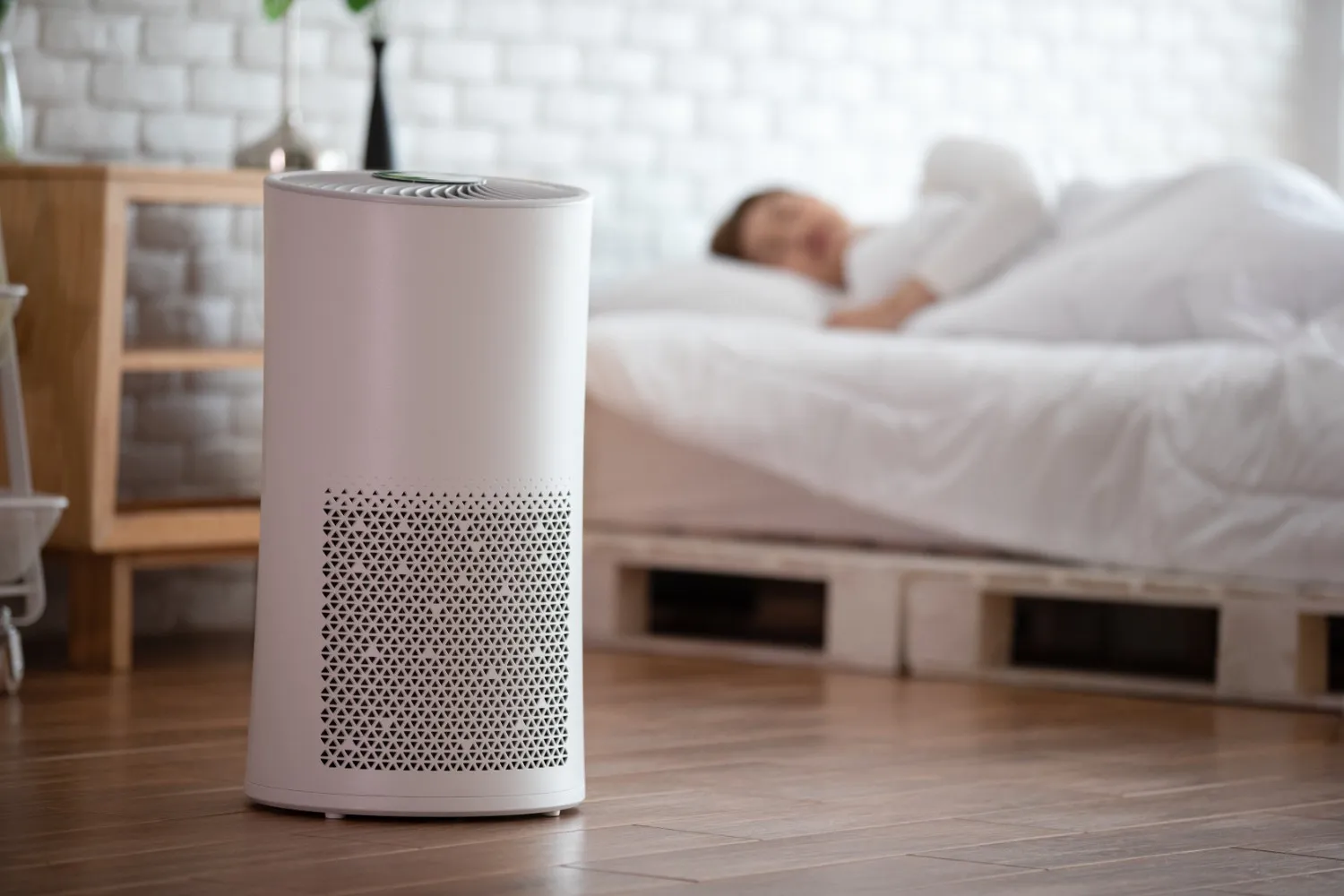 Air purifier running in peaceful bedroom.