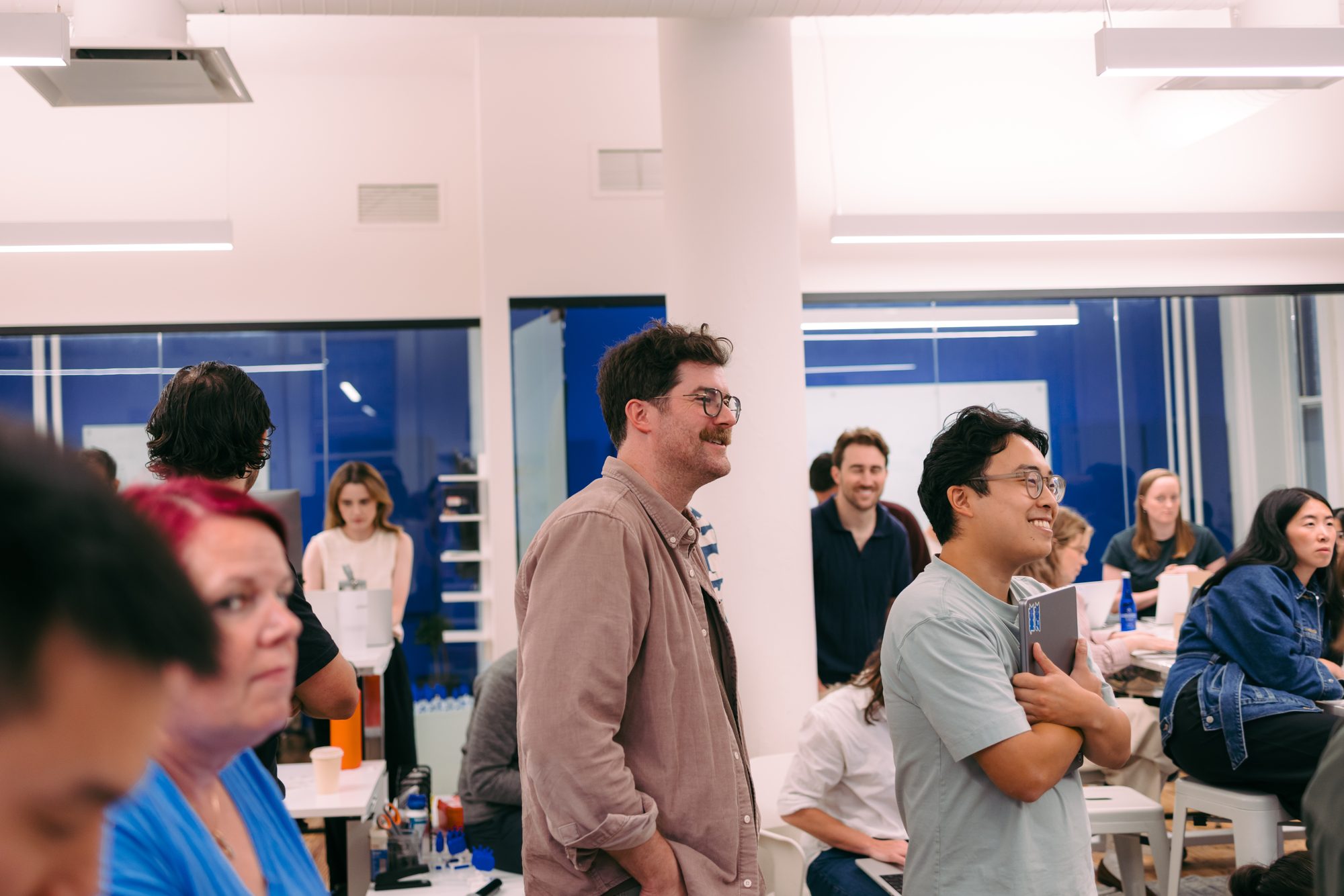 Check teammates gathered in the New York office