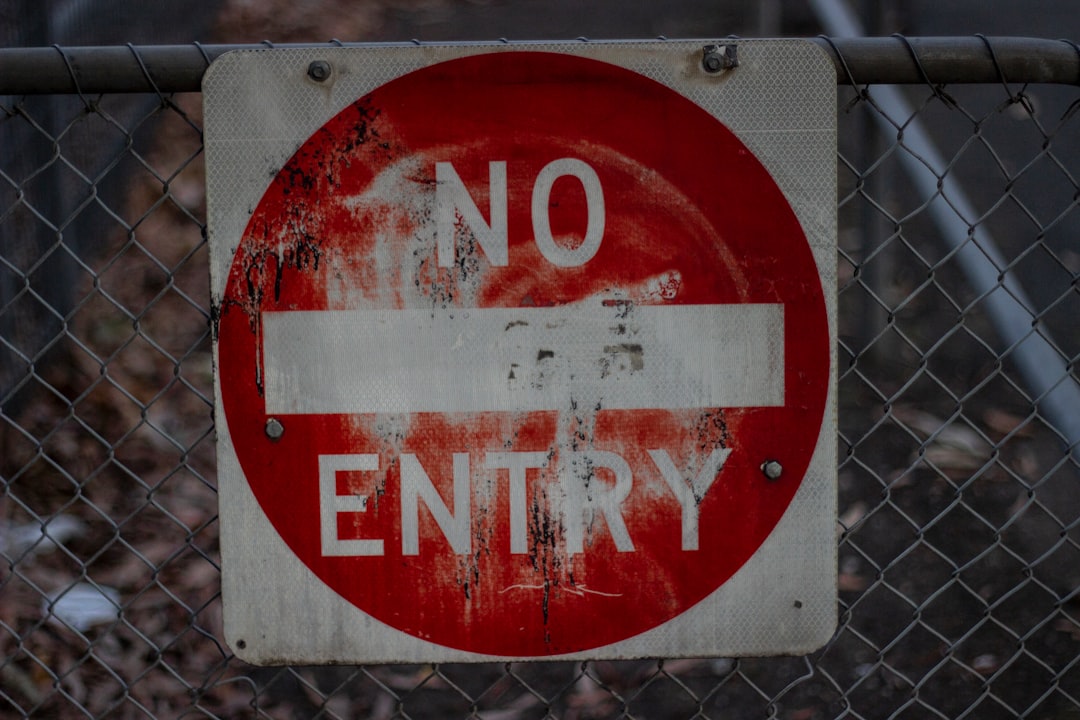Do Not Enter sign on a fence - can i remove neighbor's fence on my property massachusetts