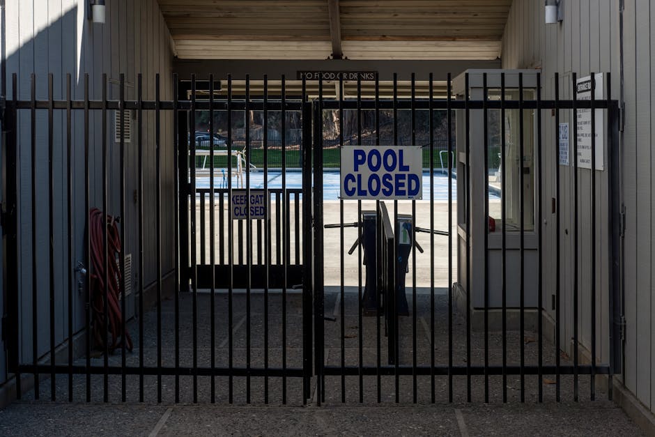 secure and compliant pool fence with a self-latching gate - Local fence company