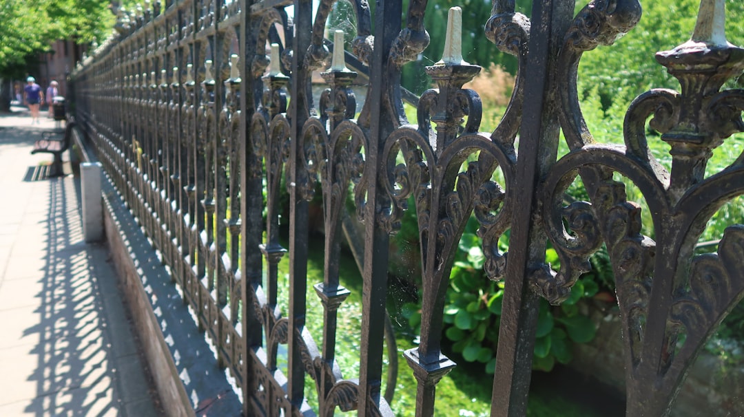 Neat ornamental aluminum fence around a landscaped garden - Backyard fence solutions Neat ornamental aluminum fence around a landscaped garden - Backyard fence solutions