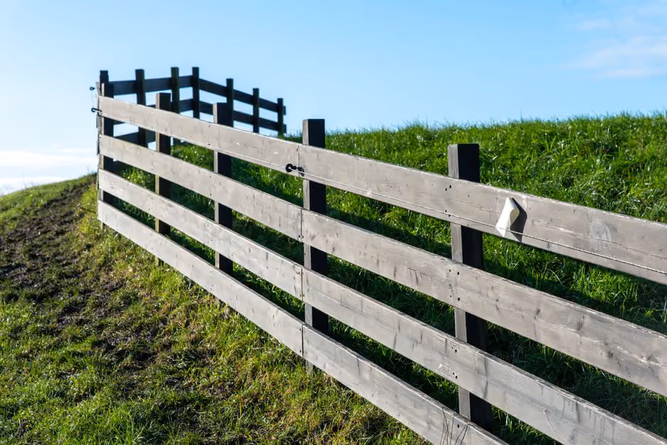 modern horizontal wood fence in a suburban backyard