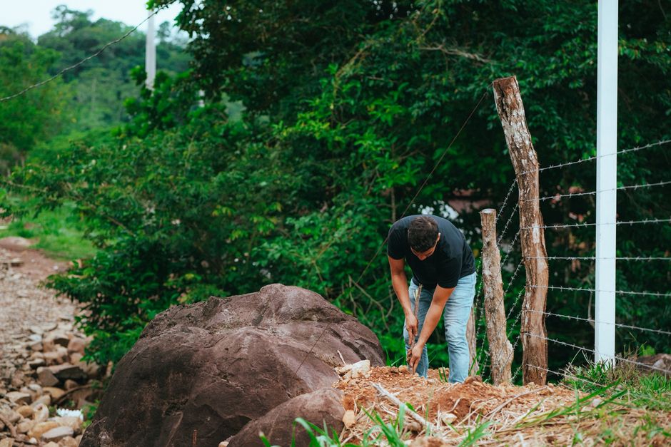 professional fence installers setting posts in concrete