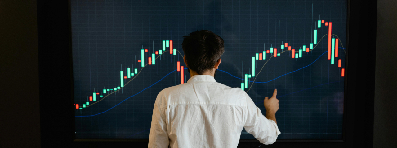 Professional analyzing conversion metrics on a large digital chart.
