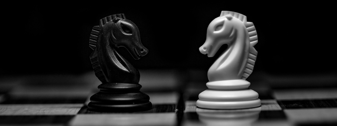 Black and white chess knights symbolizing strategic decisions in Shopify headless development