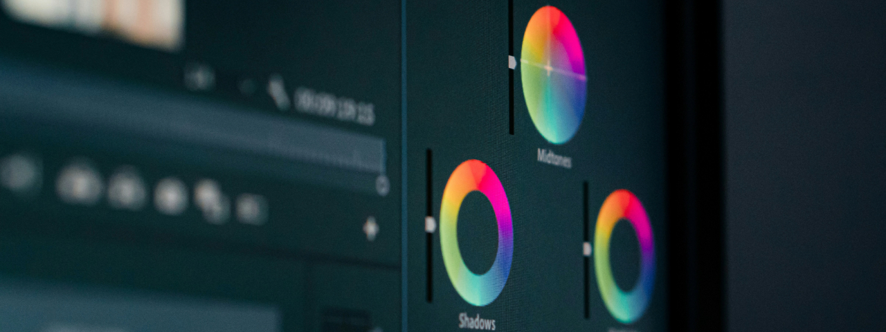 Close-up of a video editing software interface displaying color grading wheels