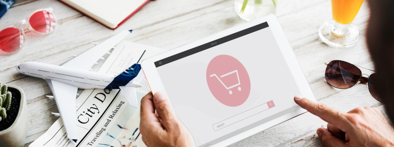 A person browsing an e-commerce store on a tablet, symbolizing the difference between attracting browsers and buyers.