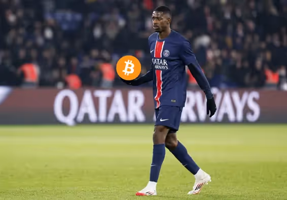 A person in a football uniform holding a bitcoinAI-generated content may be incorrect.