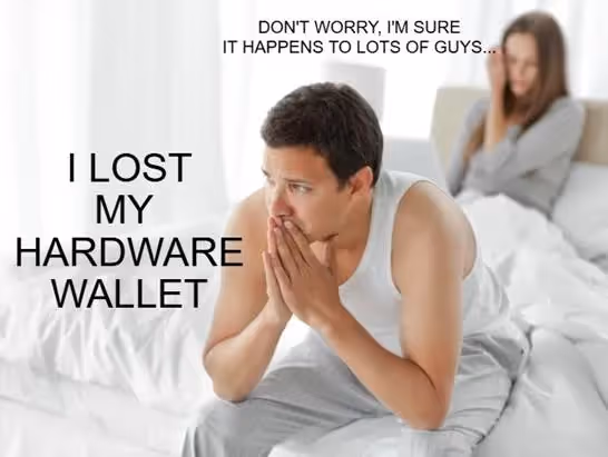 A person sitting on a bed with his hands together