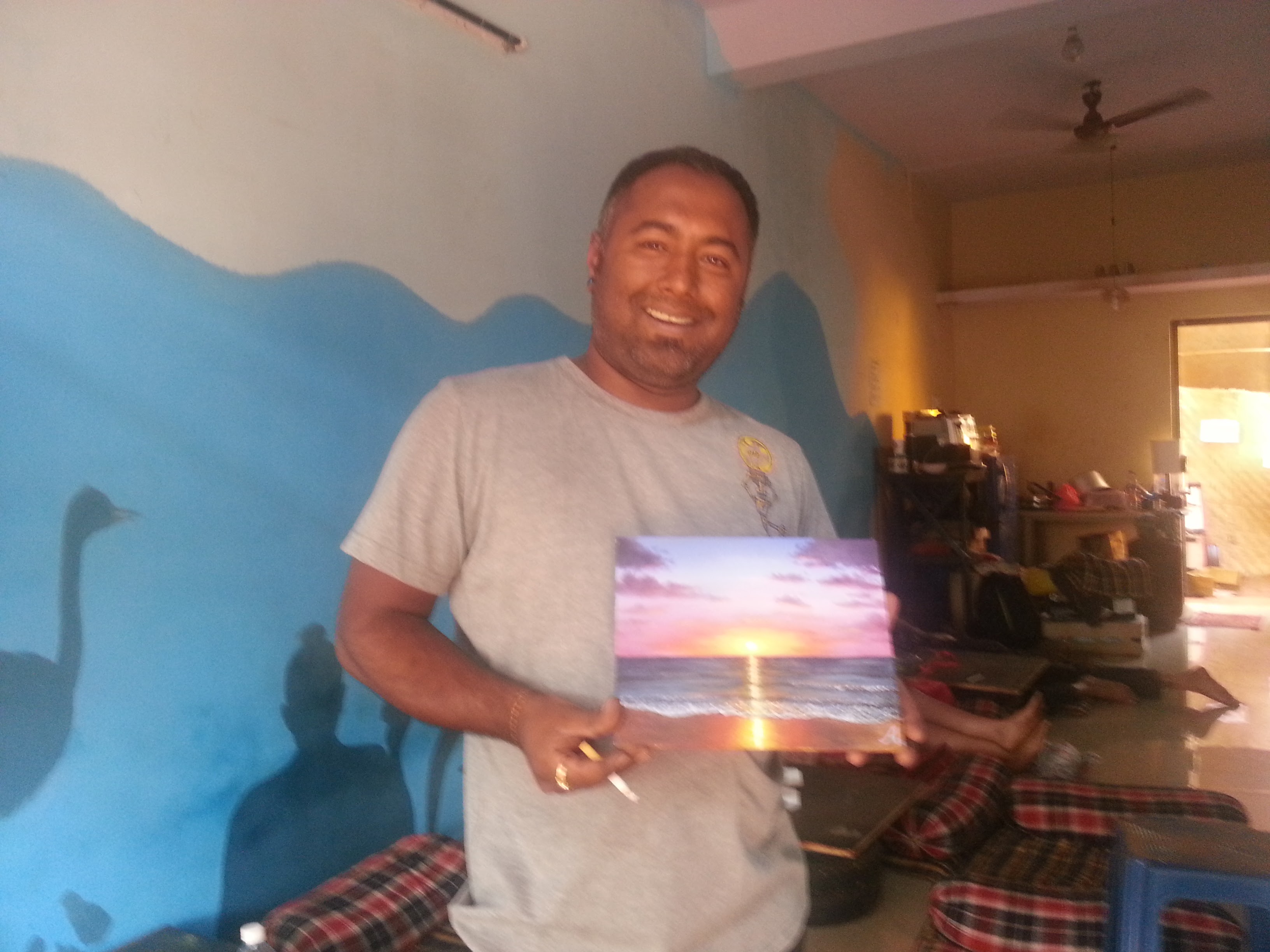 a man with a painting in his hands