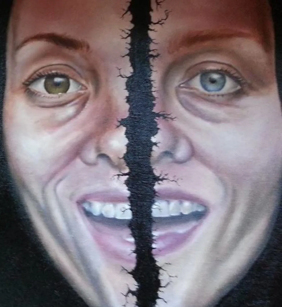 a painting of a woman's face broken in two parts