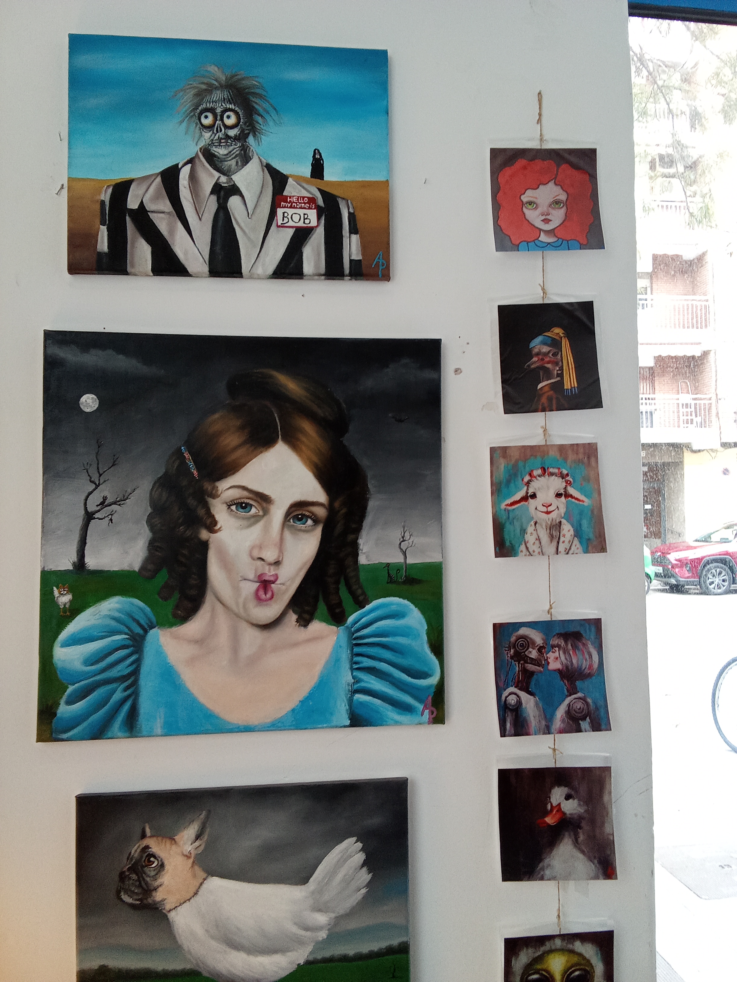 oil paintings on the wall and prints