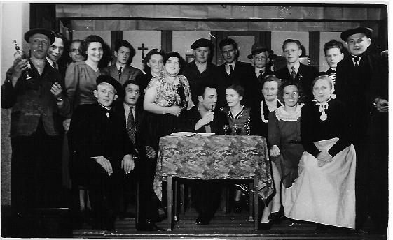 Positive young multiracial friends eating fast food and drinking beer in outdoor cafe