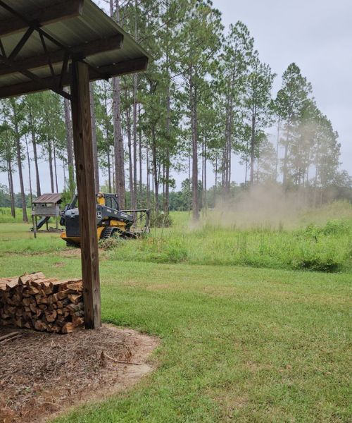 A tractor that is sitting in the grass