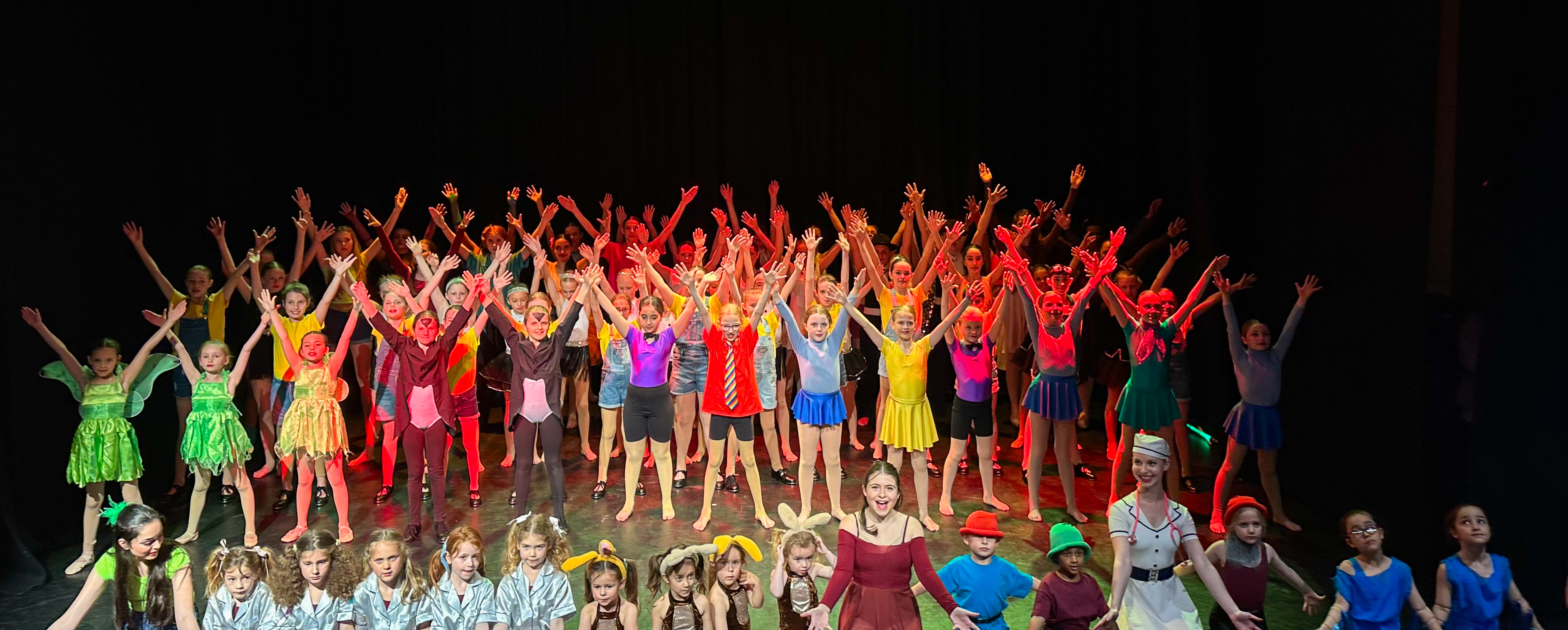 All of the dancers from the school on stage in the finale
