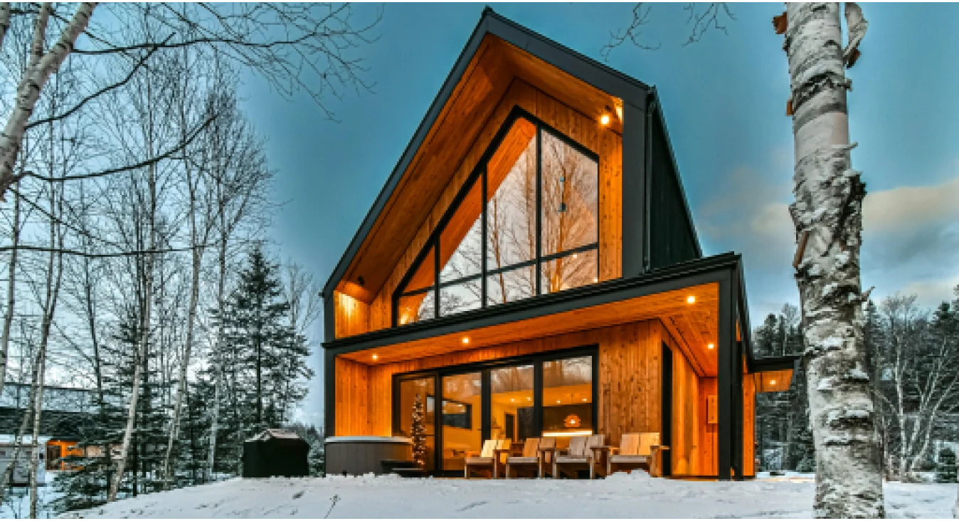 A cottage sorrounded by snow.
