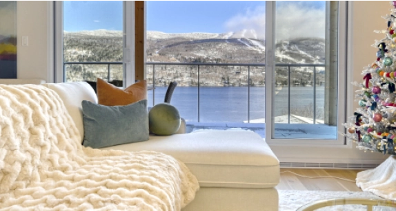 Picture of a living room with a lake view from the window