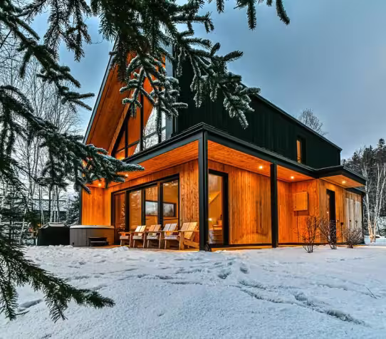 Cabin surrounded by snow.