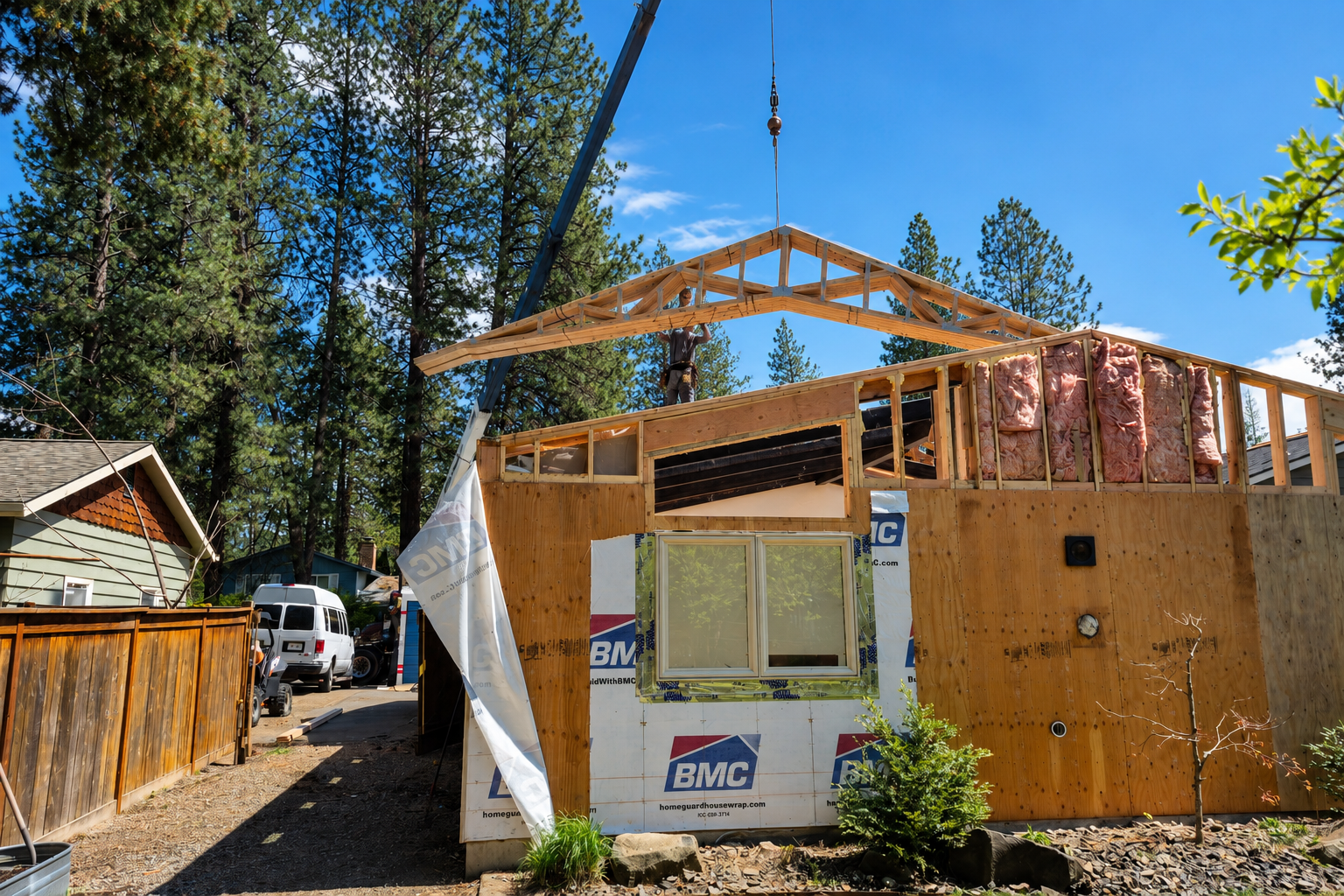 Home reconstruction project with new roof framing being installed