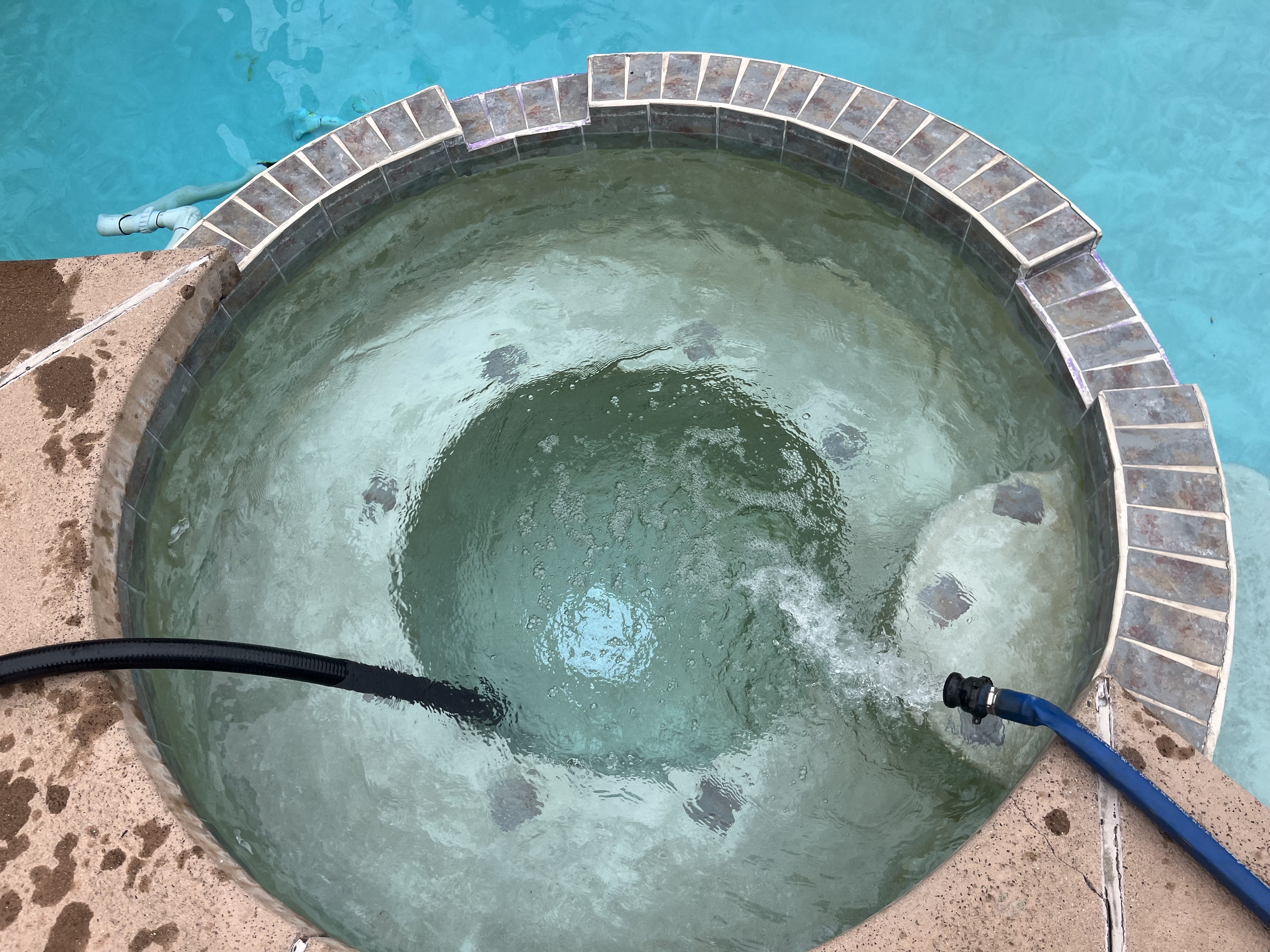 Reverse Osmosis hoses drain in and out of a spa to improve the high CYA levels by 88%