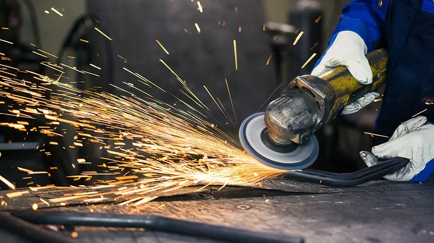 Metal grinder producing sparks.