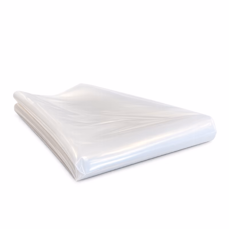 The image shows a neatly folded stack of translucent white plastic sheets or bags, arranged in a compact rectangular bundle.