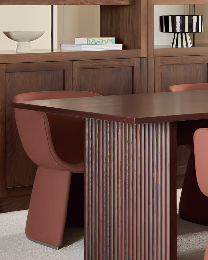 The base of a slab end table with dowels in stained walnut finish