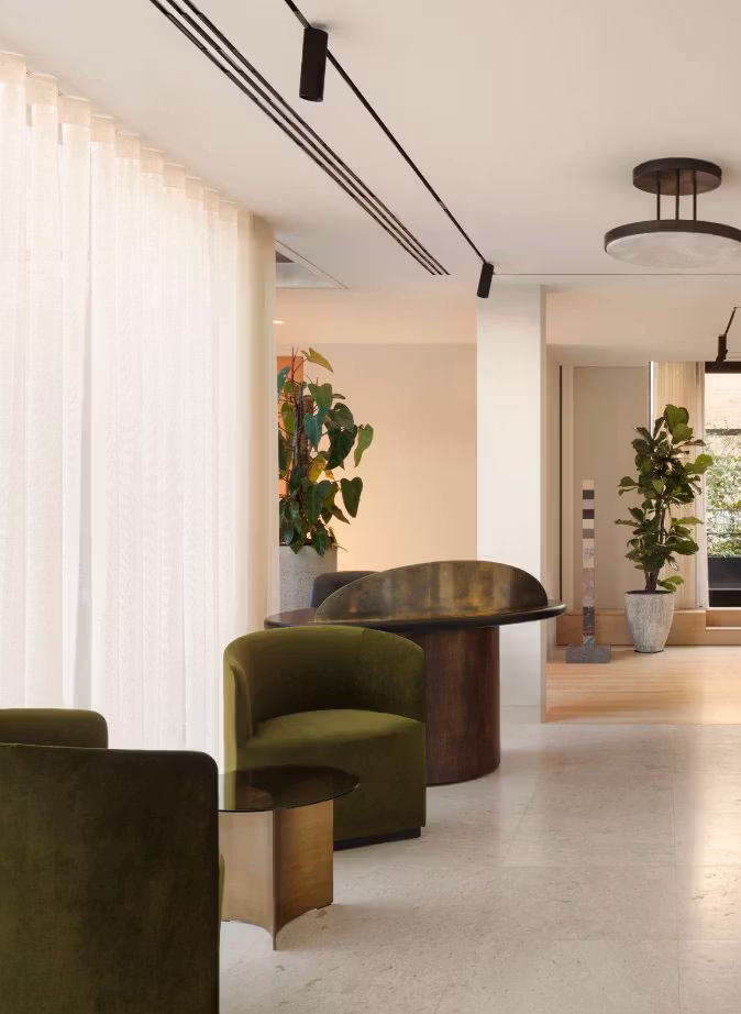 Bespoke reception desk in walnut with a marble divider