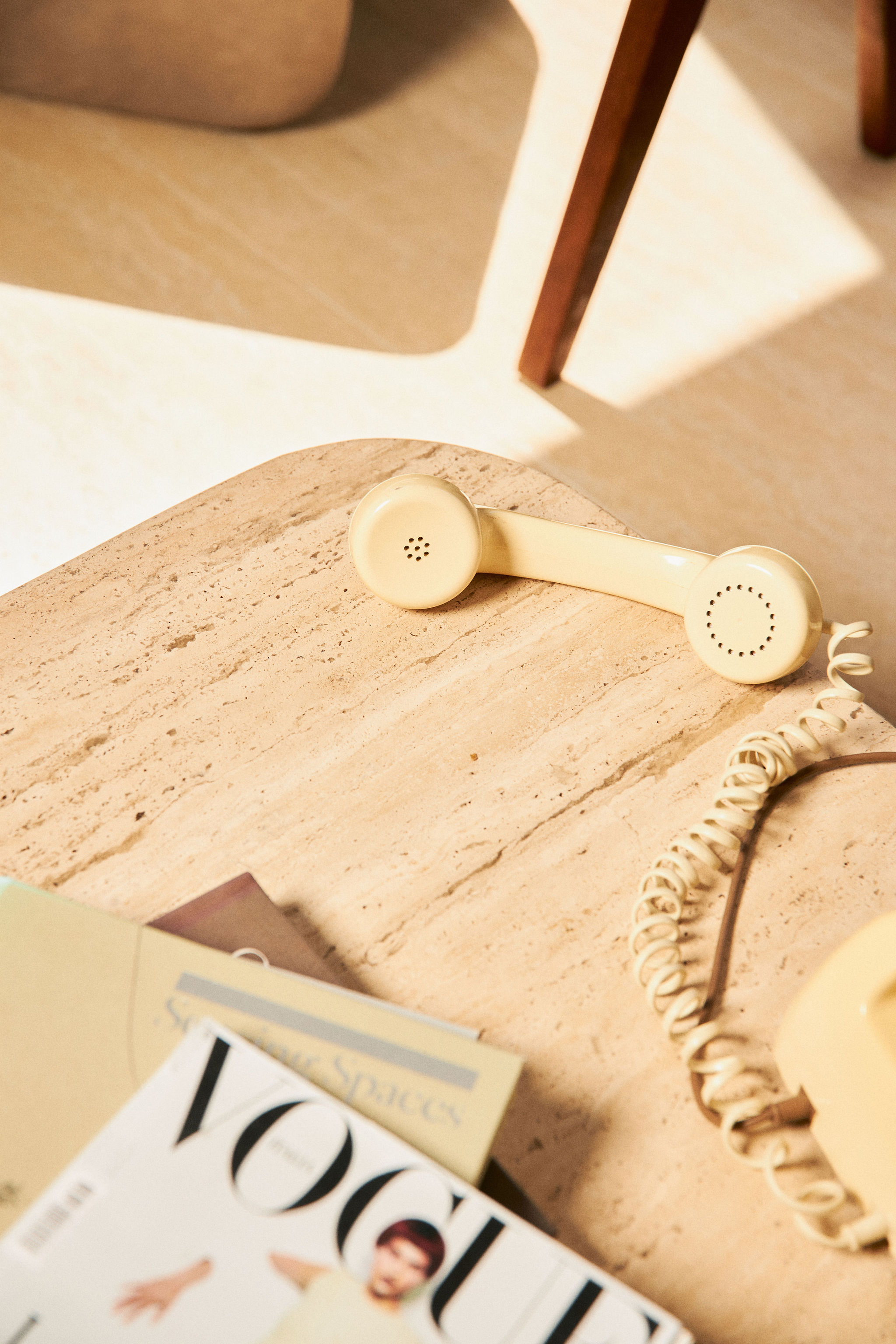 Vintage telephone and Vogue Magazine during a brand photography session.